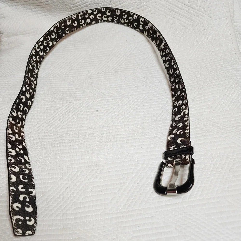 100% calf hair leather‎ dark brown, white spotted belt.